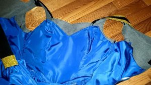 View of dress with sleeves cut off.