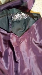 Inside of the dress, at center front.