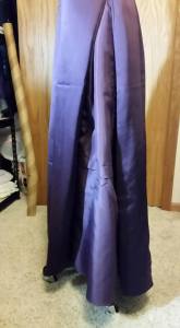 Extra lining fabric sewn into side skirt seams.  No petticoat.