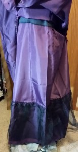 Lining:  note the petticoat net at the bottom, and the black line of the bodice interfacing, which extends beyond the actual dress bodice.   These design features affected the length of the skirt lining.