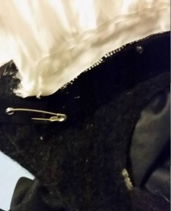 Ribbon tie pinned to paste.