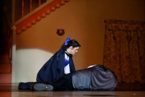 Laying with back to audience, beginning to remove Beast-wear, while Belle sings.