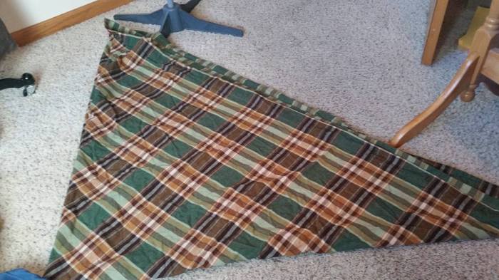 Folded in quarters to cut the waist opening.