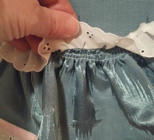 ruffle topstitched on, covered with eyelet ruffle