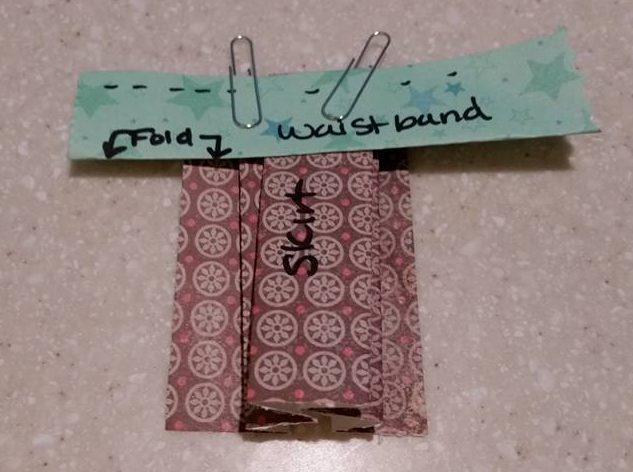 folded waistband sewn to skirt.