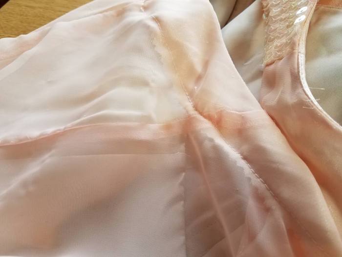 facing stitched down, and dress fabric cut away