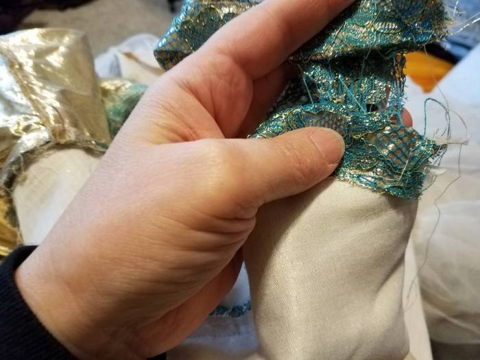 seam is open, lace was appliqued on top.  I cut this