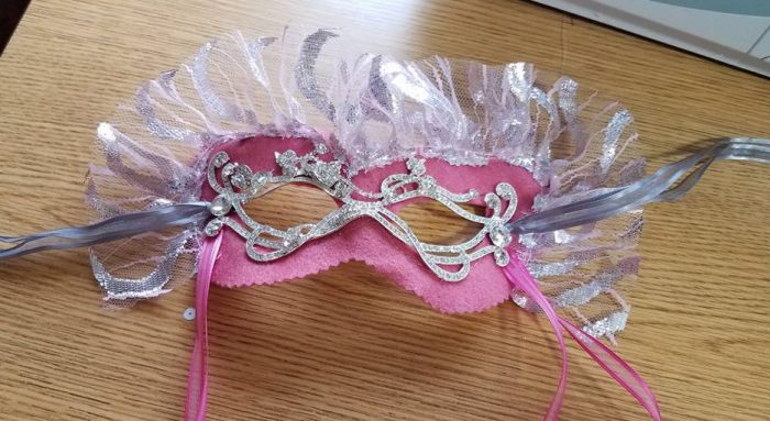 front of Gabrielles mask