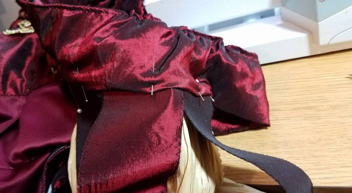 pinning shoulder drape to sleeve