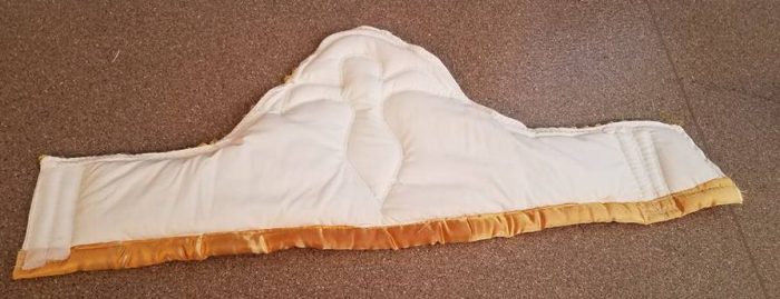 back of hat--religious figure