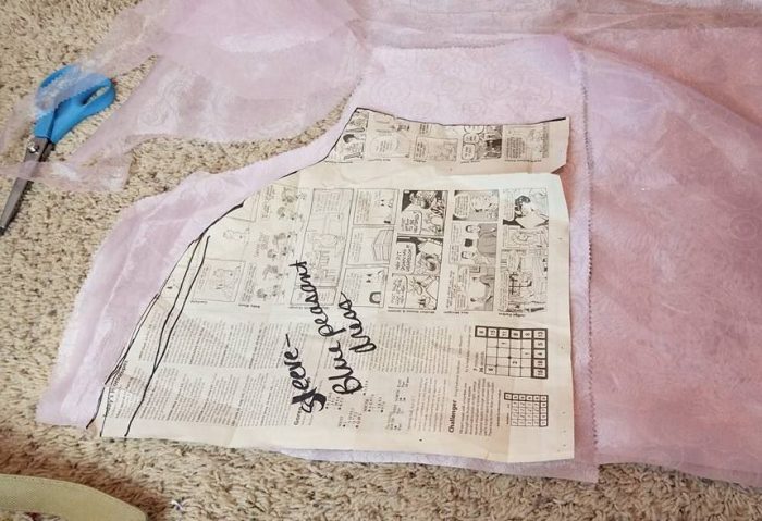 cutting out the sleeves.