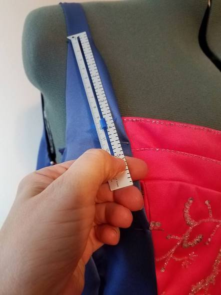 measuring to get the pink dress attached evenly