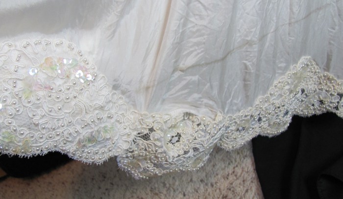 previous alteration on him, and fold mark on dress