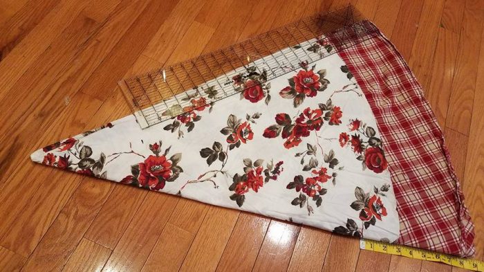 tablecloth folded in 1/8s and marking the cutting line