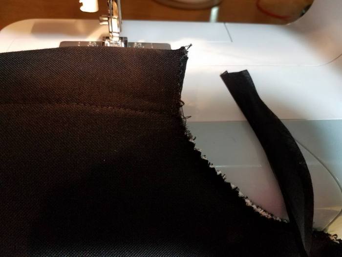 binding the neck opening with bias tape