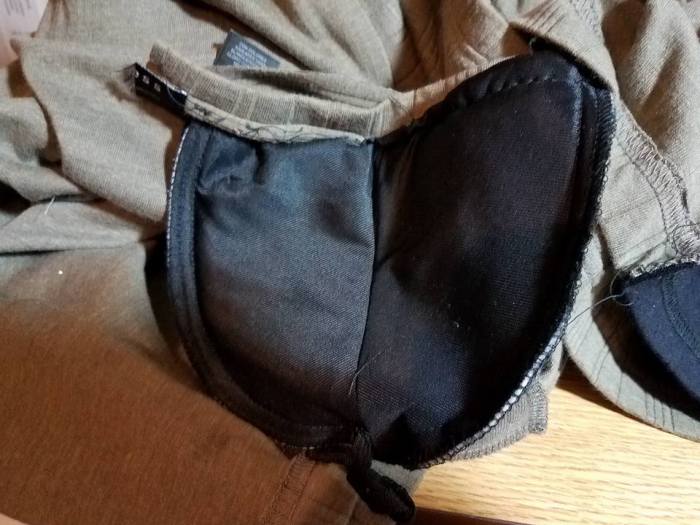 adding shoulder pads to the shirt.