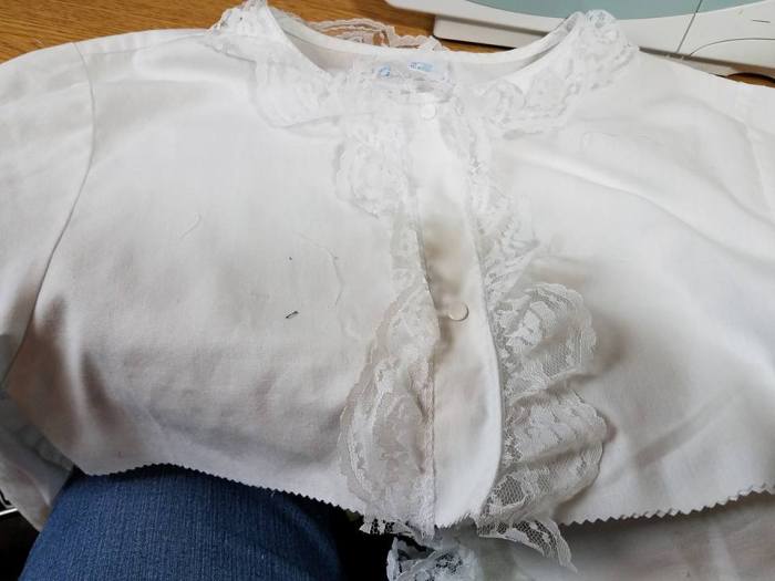 lace added to the neckline and the front