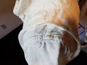 tucks over the shoulder